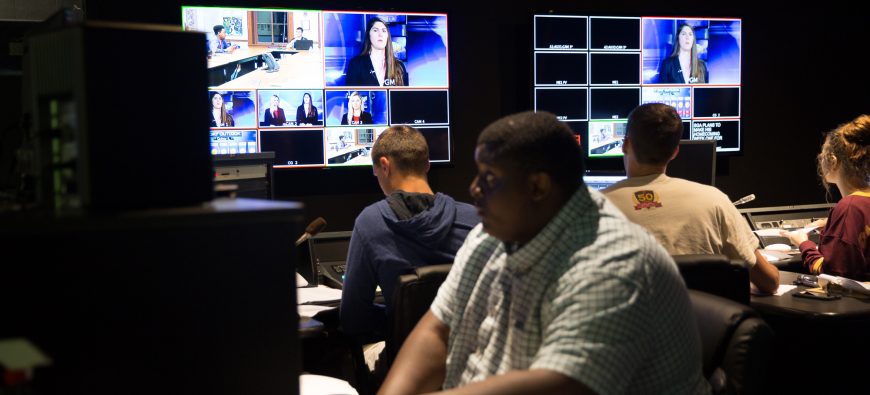 Some students editing the behind the scenes at eh QUTV studio