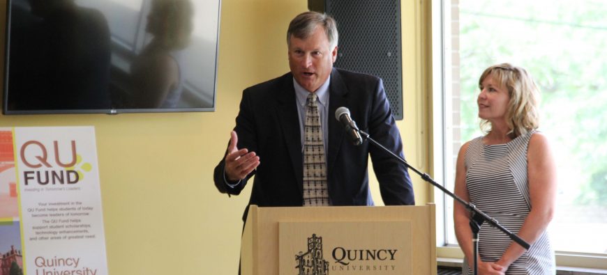 Man and woman giving a speech at Quincy University