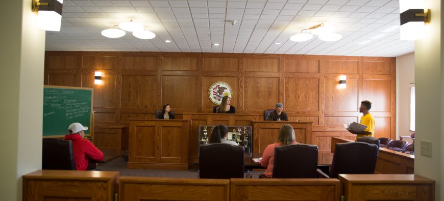Students working in the courtroom