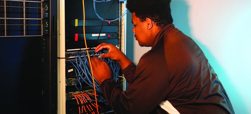 Student studying electrical panel