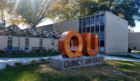 QU Sign in front of Helein Hall