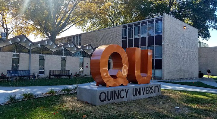 QU Sign in front of Helein Hall