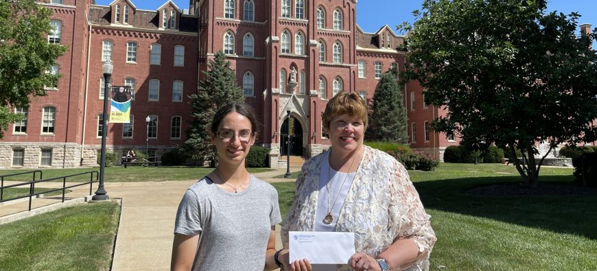 Linda Moore and Hannah Meyer in front of Francis Hall