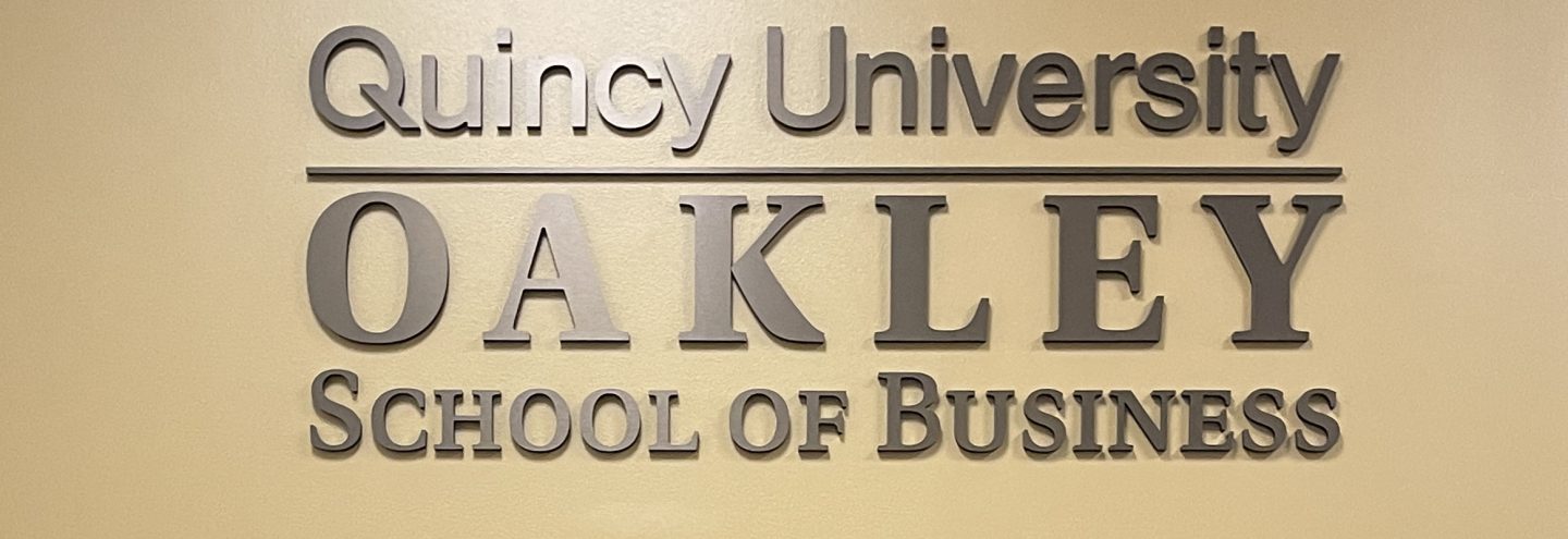 QU Oakley School of Business Sign