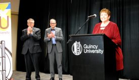 Linda Giving a Speech at the Closing of the QU Fund