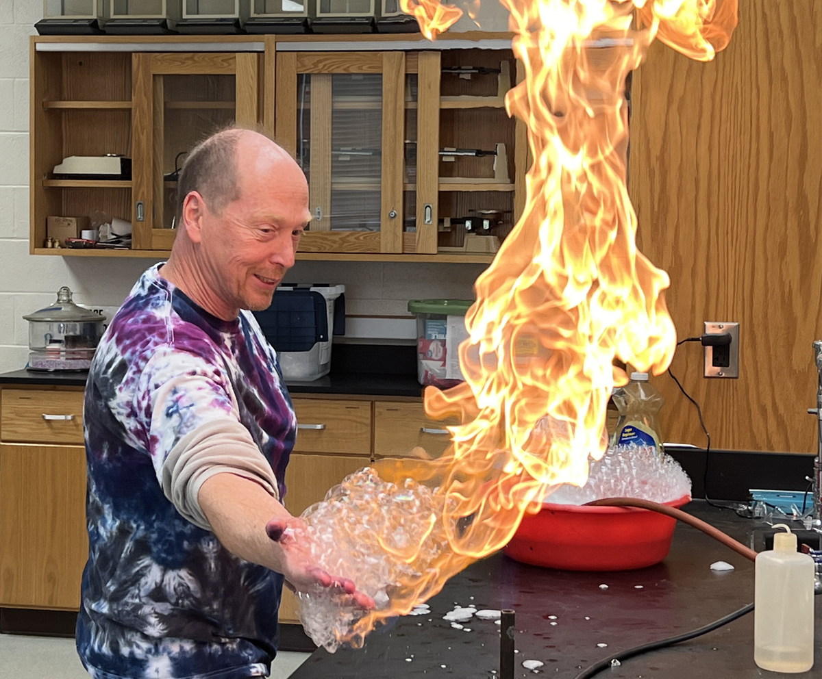 Instructor sharing a Chemistry experiment with fire