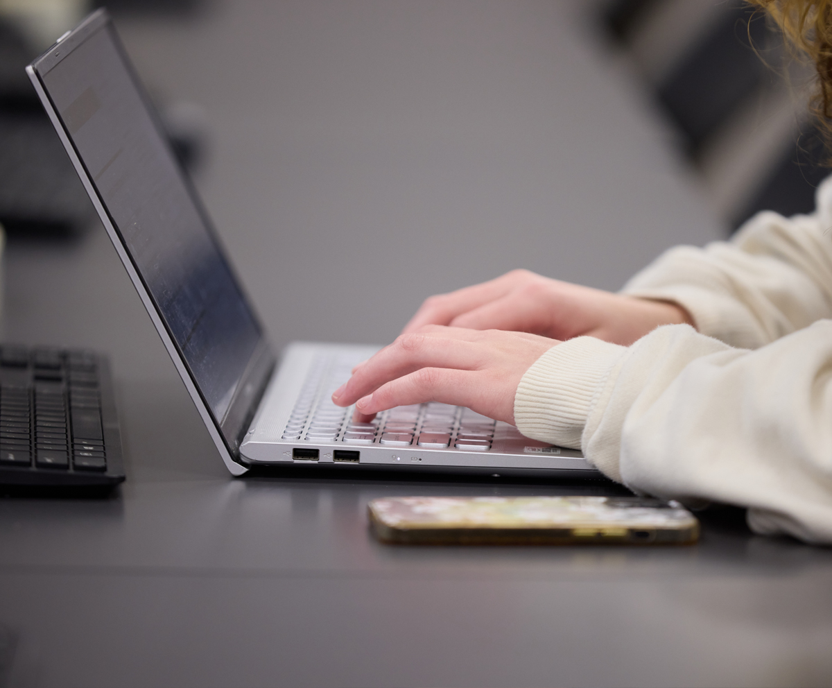 hands on a laptop keyboard