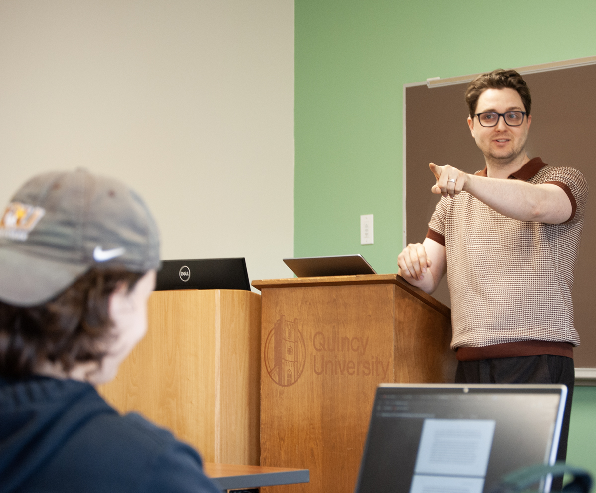 History professor pointing toward student