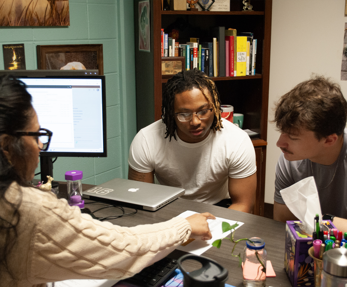 Counselor with two college students