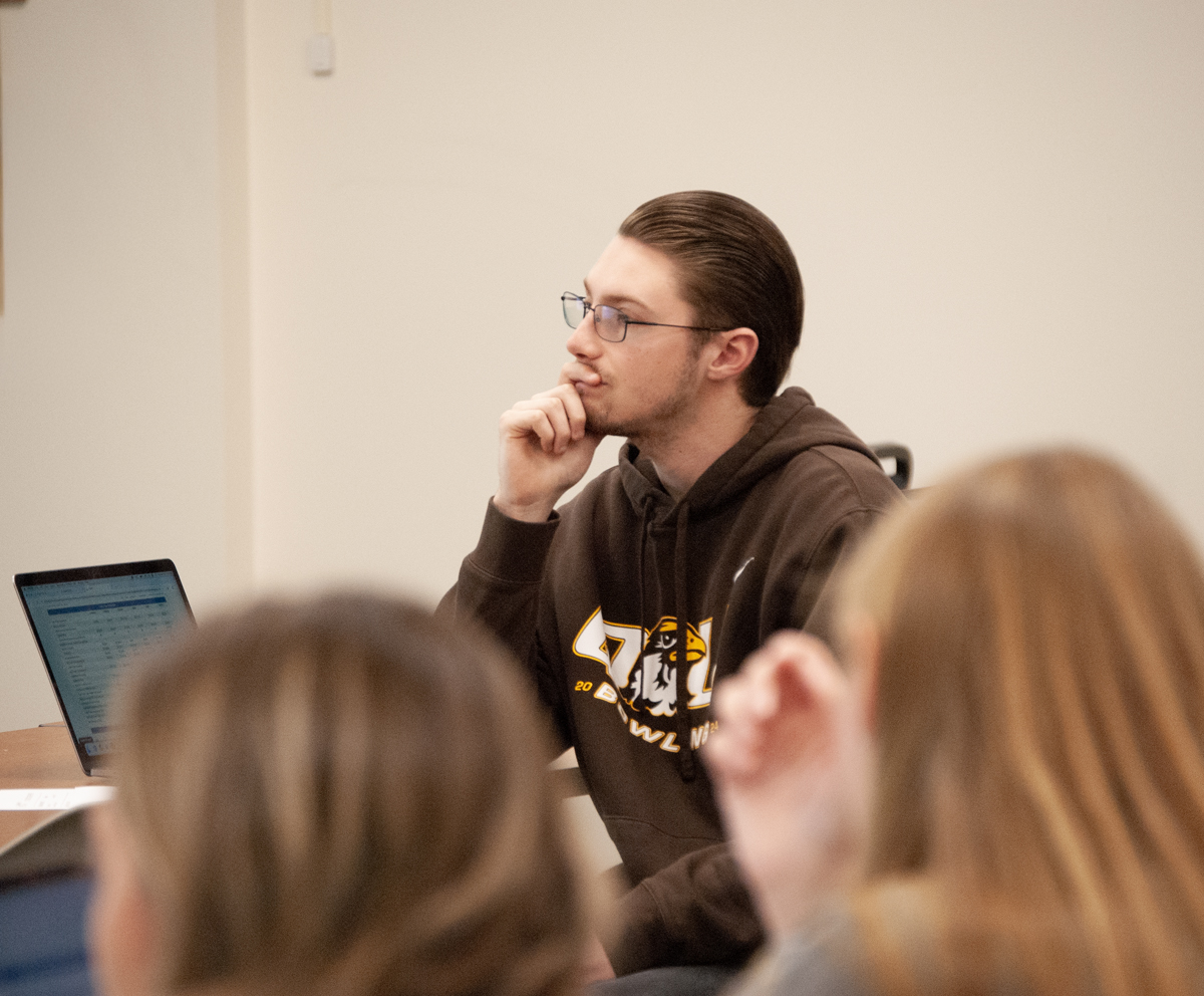 Accounting major listening to professor in class