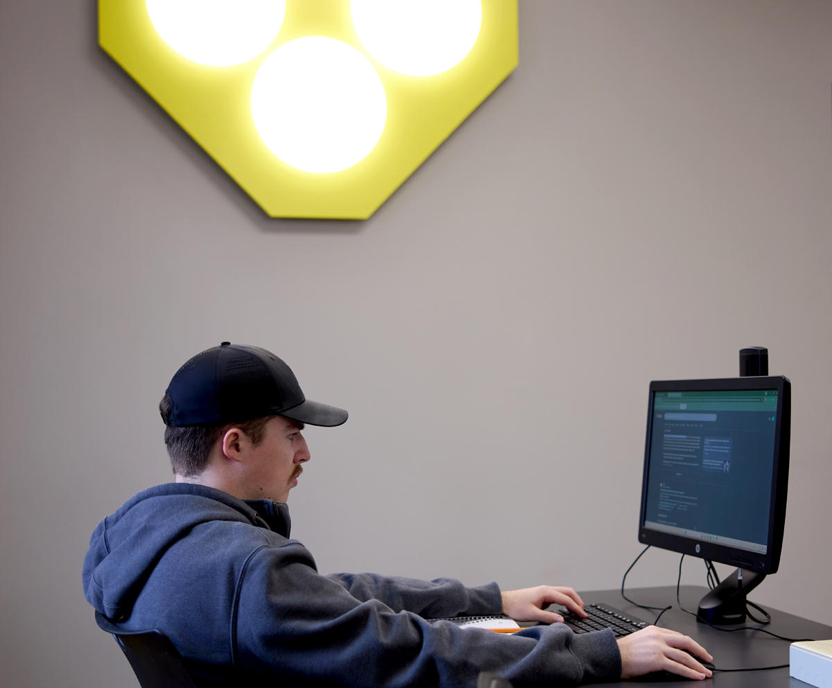 Student at a computer in cybersecurity lab