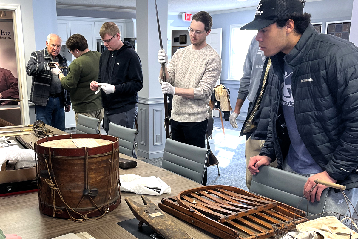students looking at civil war artifacts