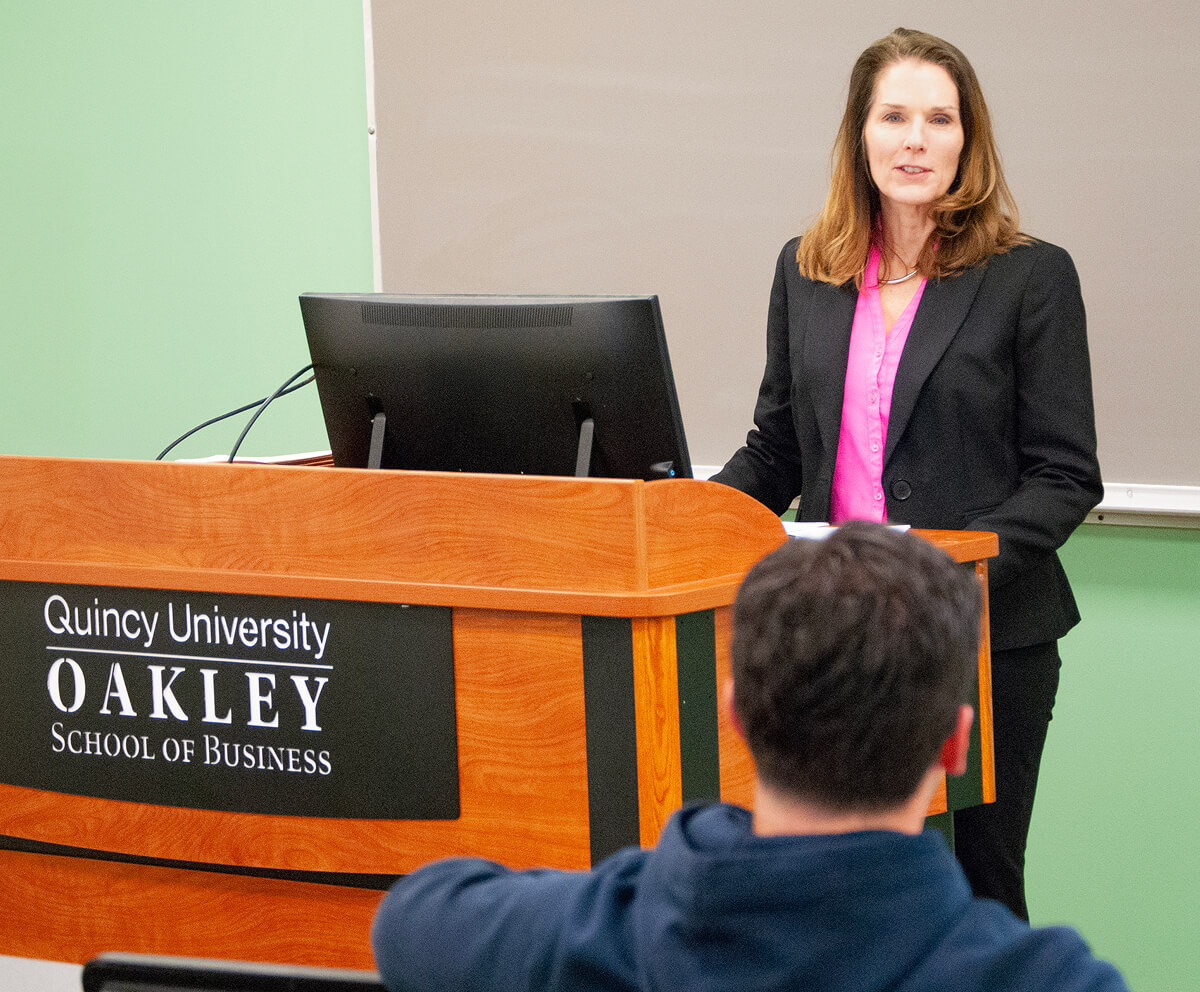 Oakley School of Business professor presenting to class