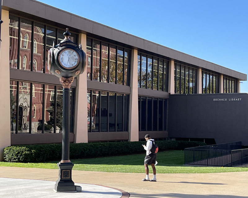 Brenner Library with student walking