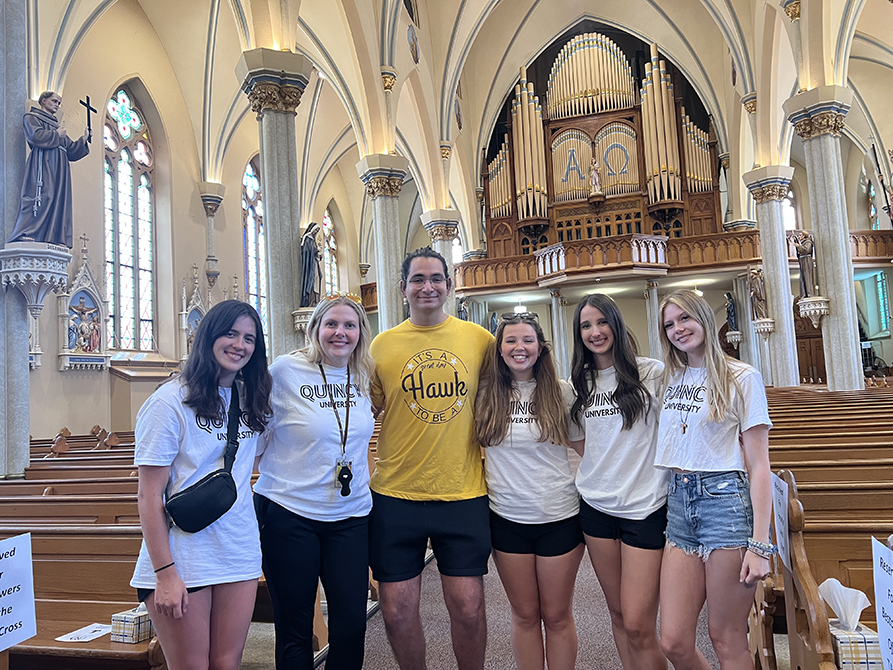 Student life team standing in a church