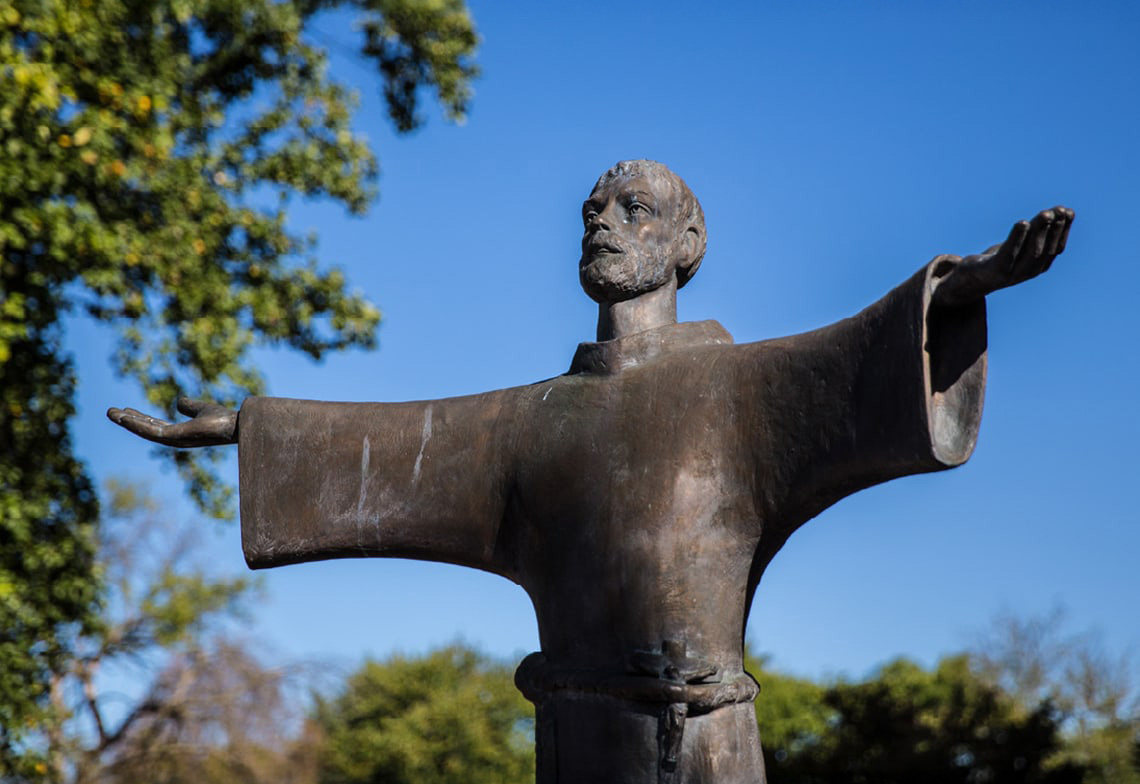 St. Francis of Assisi statue with open arms