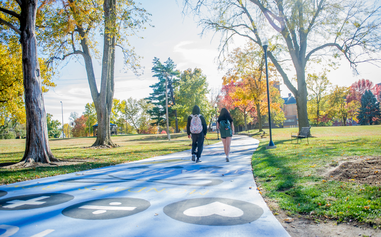 two students walking on penny lane