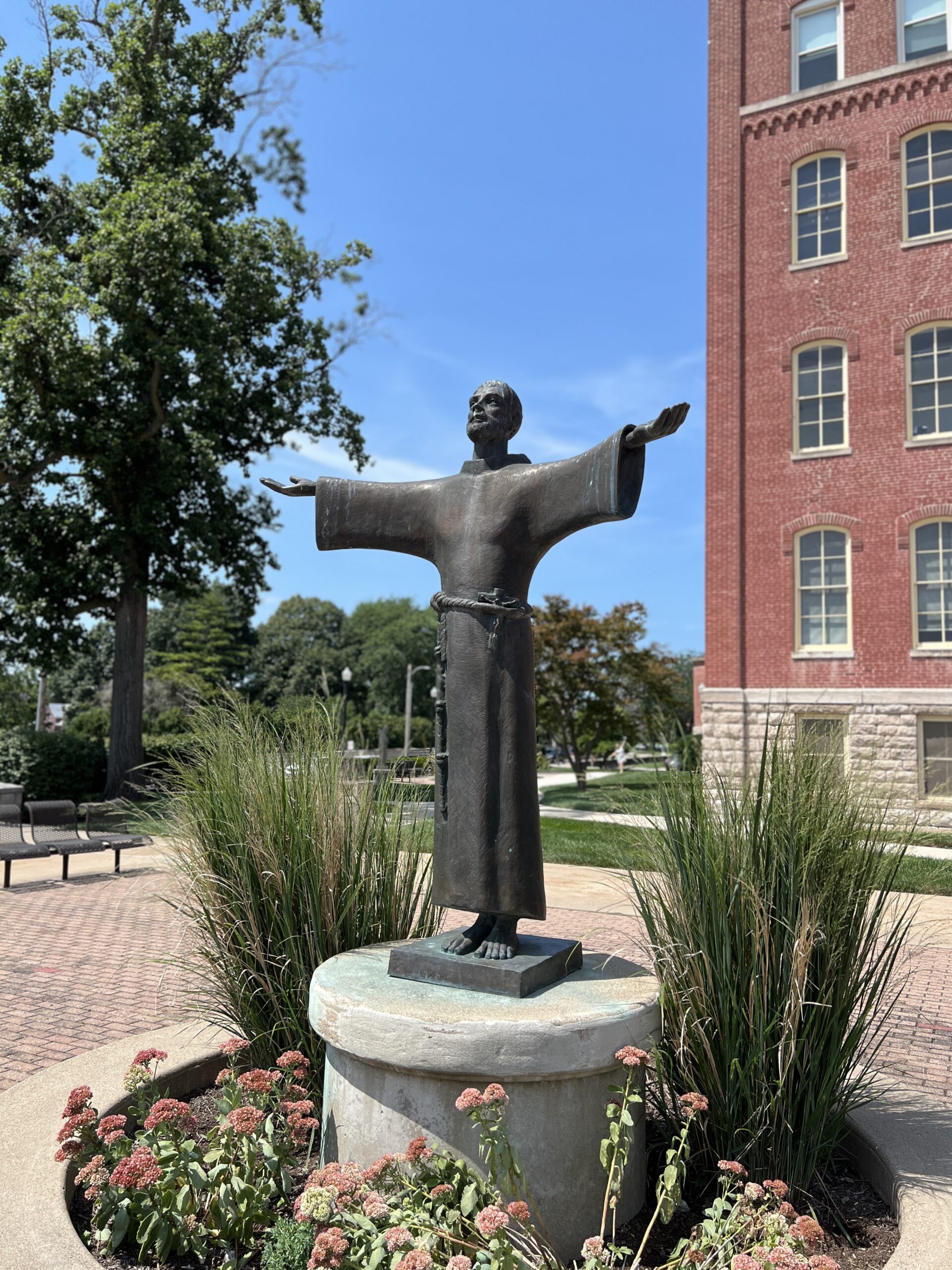 photo of St Francis statue in front of Francis Hall