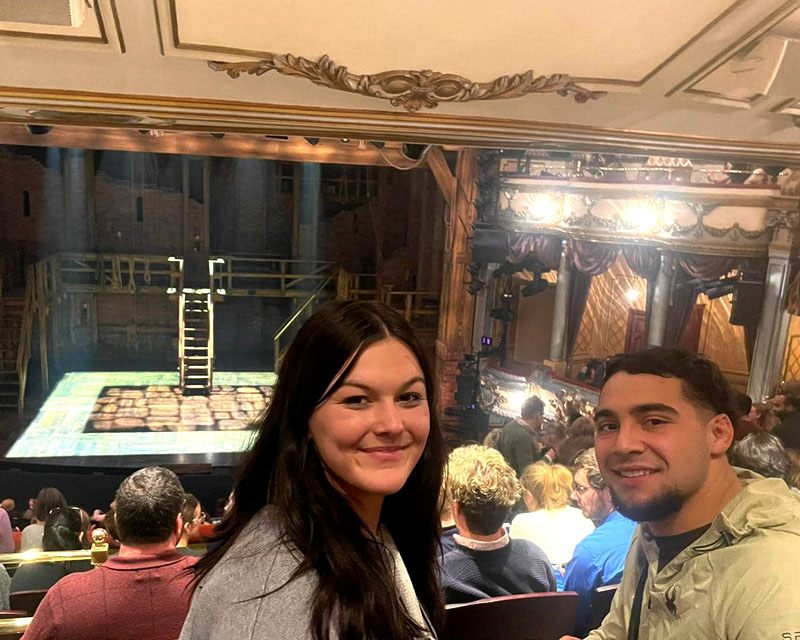 QU students seated in theatre to watch Hamilton