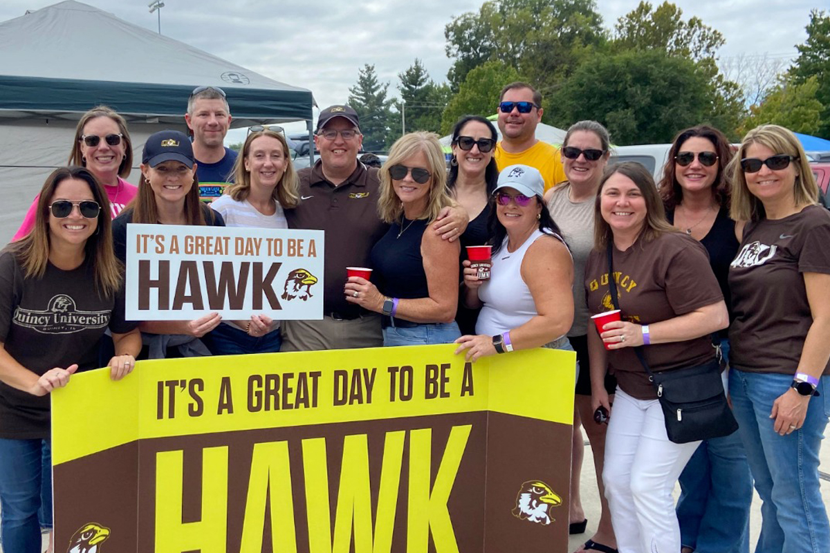 Alumni together for a photo