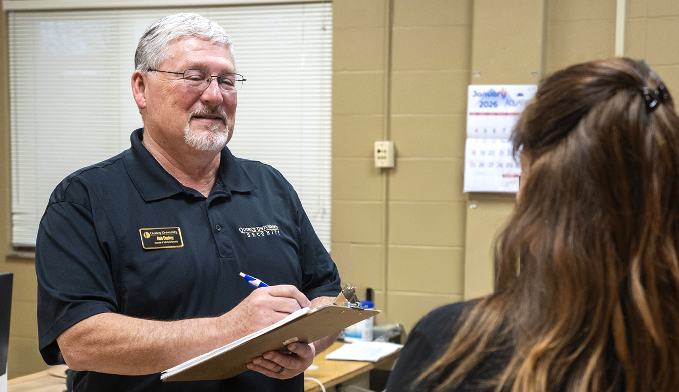 Security officer talking with student