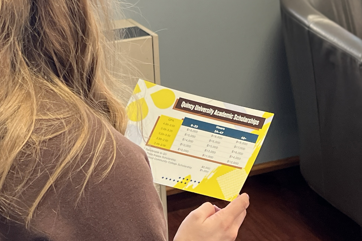 student looking at scholarships