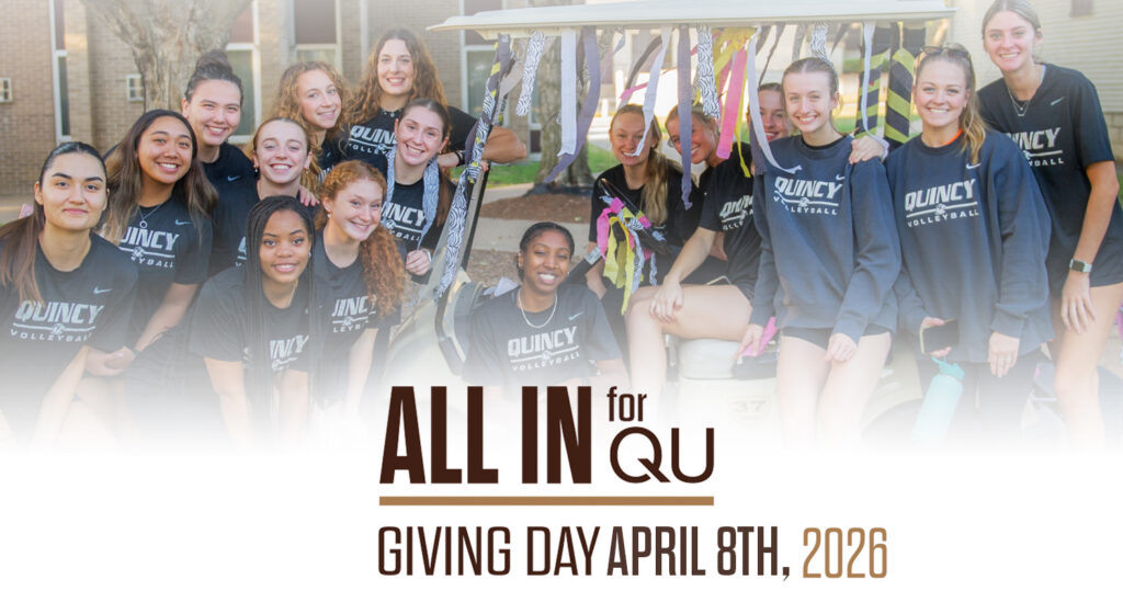 QU Volleyball team posing for a photo during homecoming parade