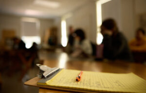 closeup of a notebook on a desk in a classroom