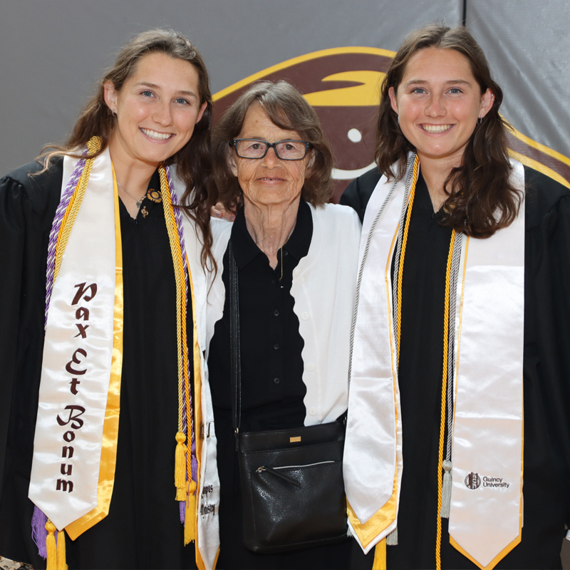 two twin grads with lady