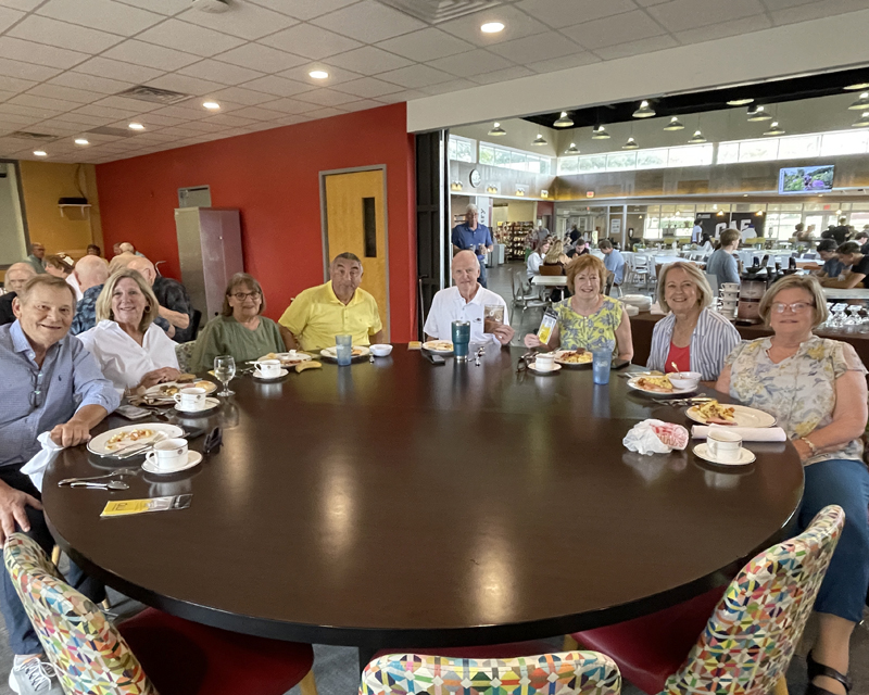 alumni group sitting at a table at brunch