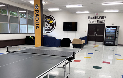 padua hall lounge with tv, couches and ping pong table